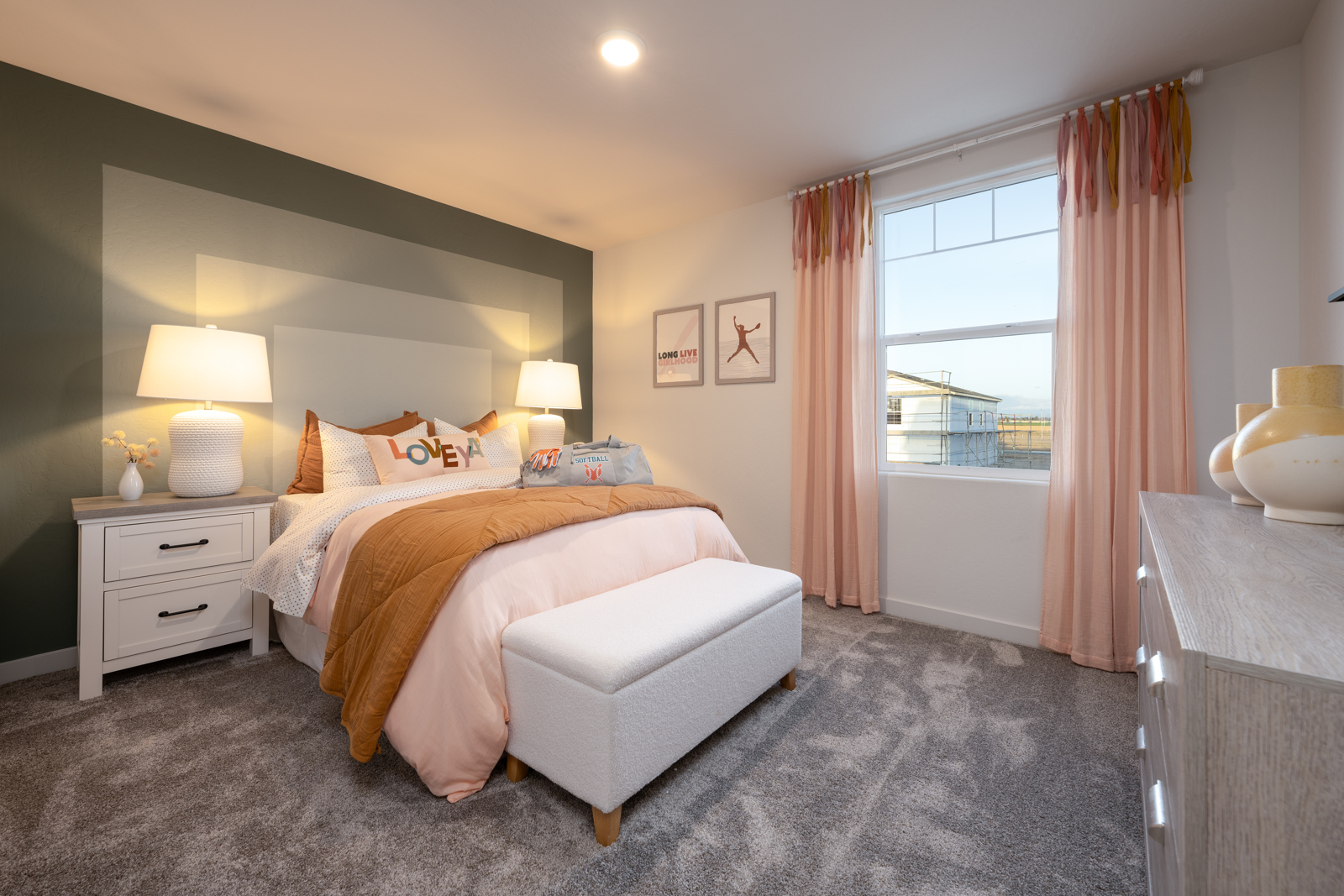 A bedroom with a large window.