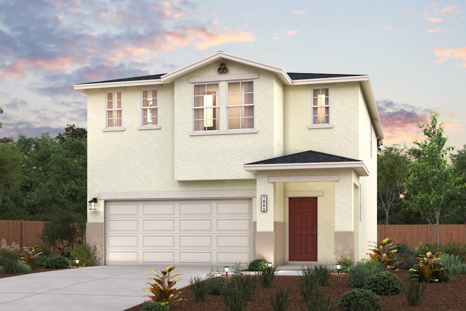 A white house with a garage.