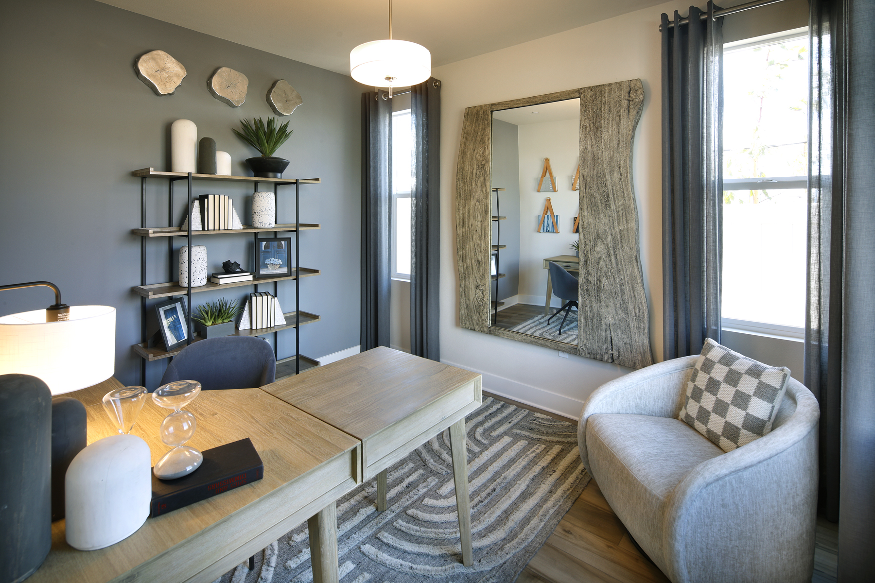 A living room with a table and chairs.