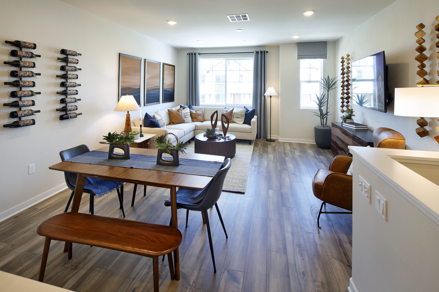 A living room with a table and chairs.