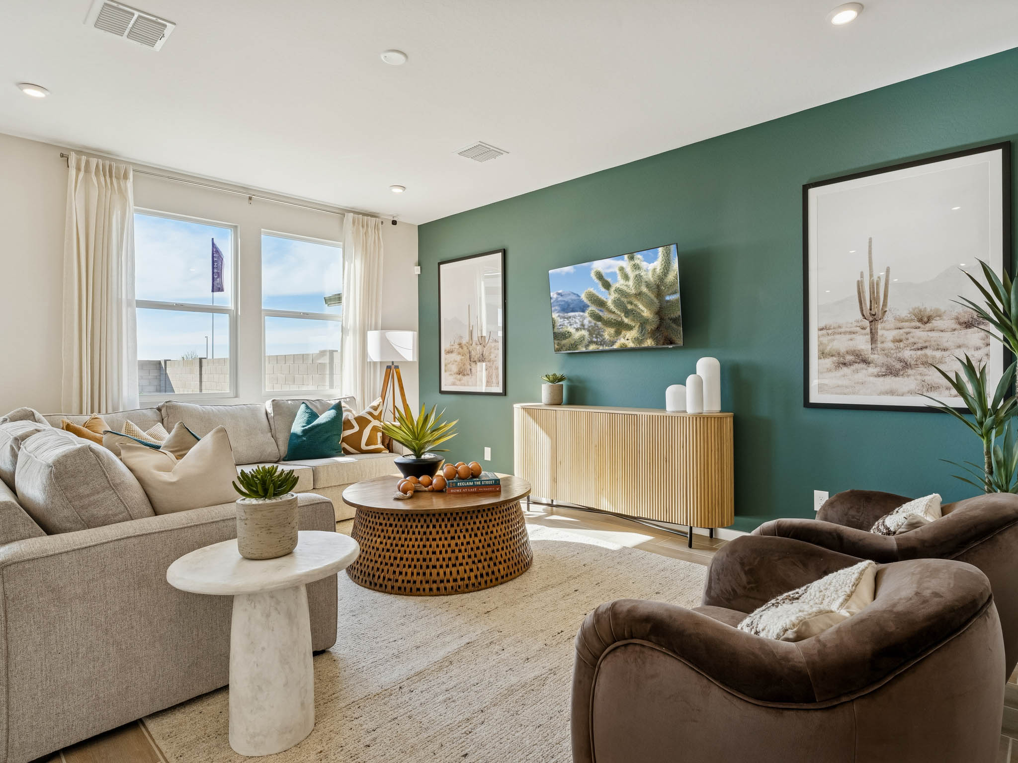 A living room with a green wall.