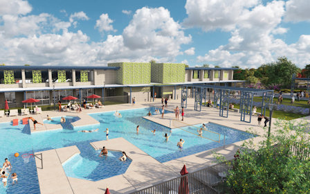 A large swimming pool with people in it.