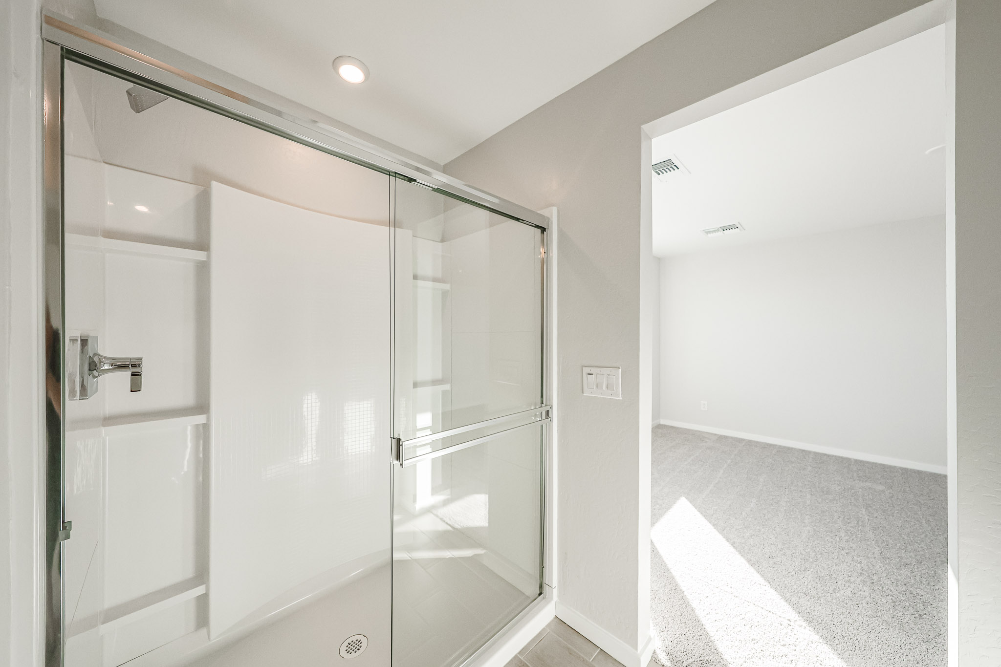 A bathroom with a glass shower.