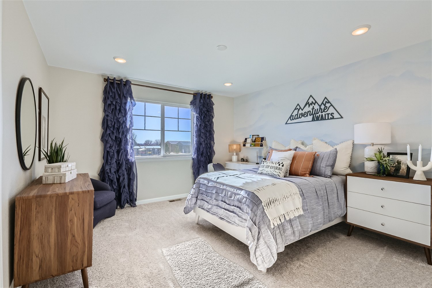 A bedroom with a bed and a window.