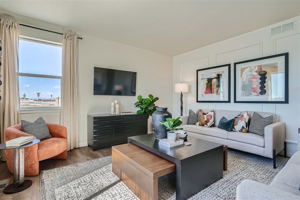 A living room with a couch and a coffee table.