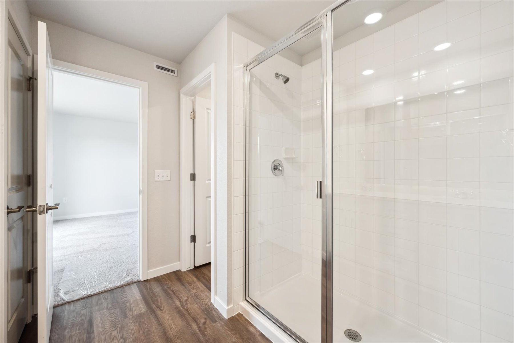 A bathroom with a glass shower.