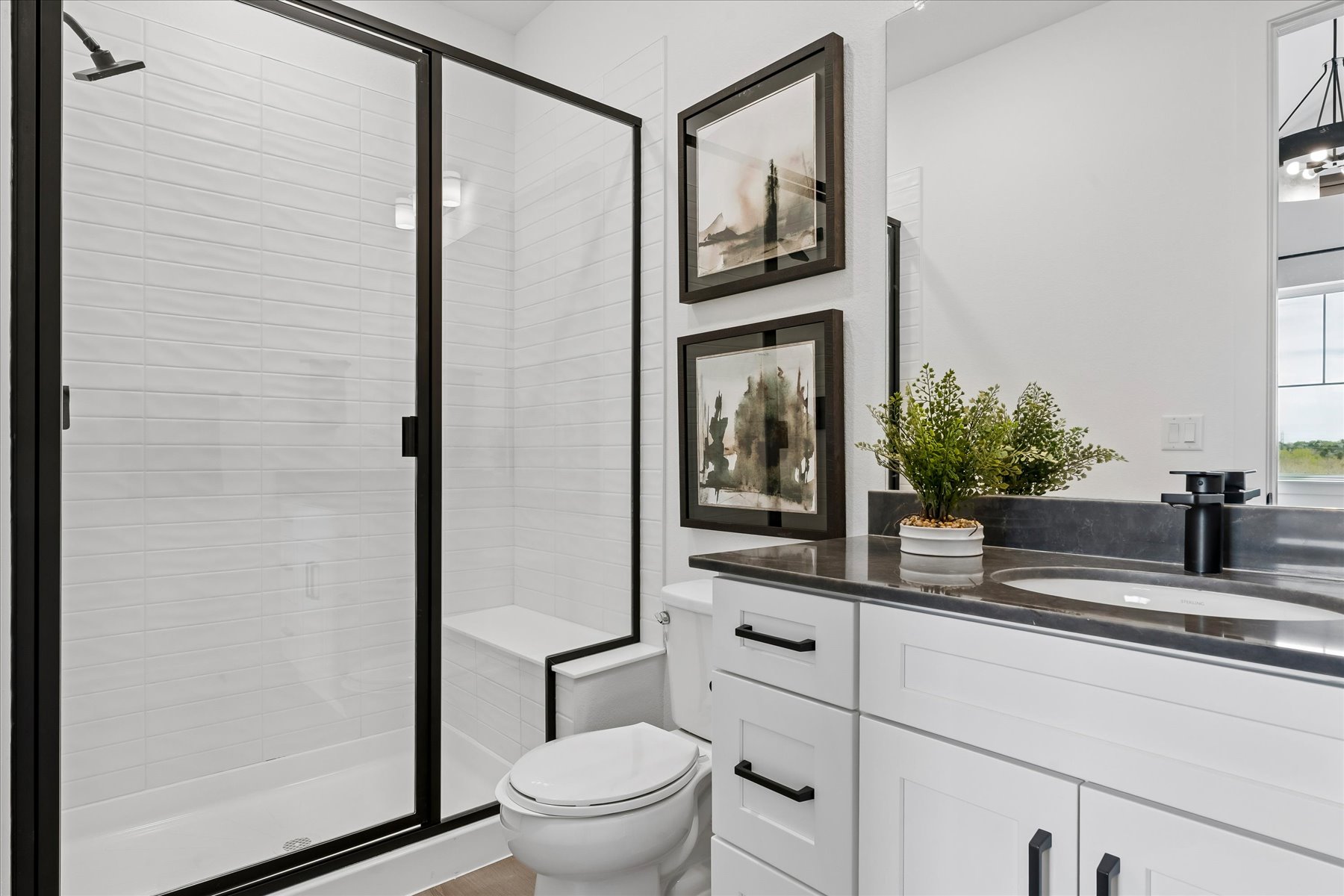 A bathroom with a glass shower.