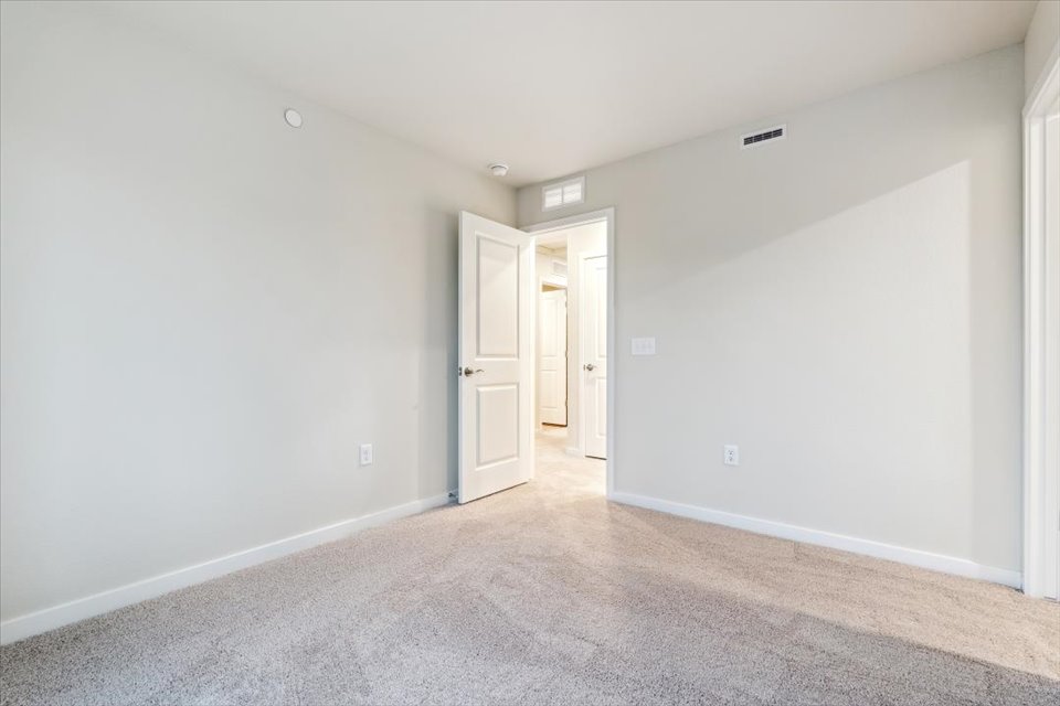 A hallway with white walls.