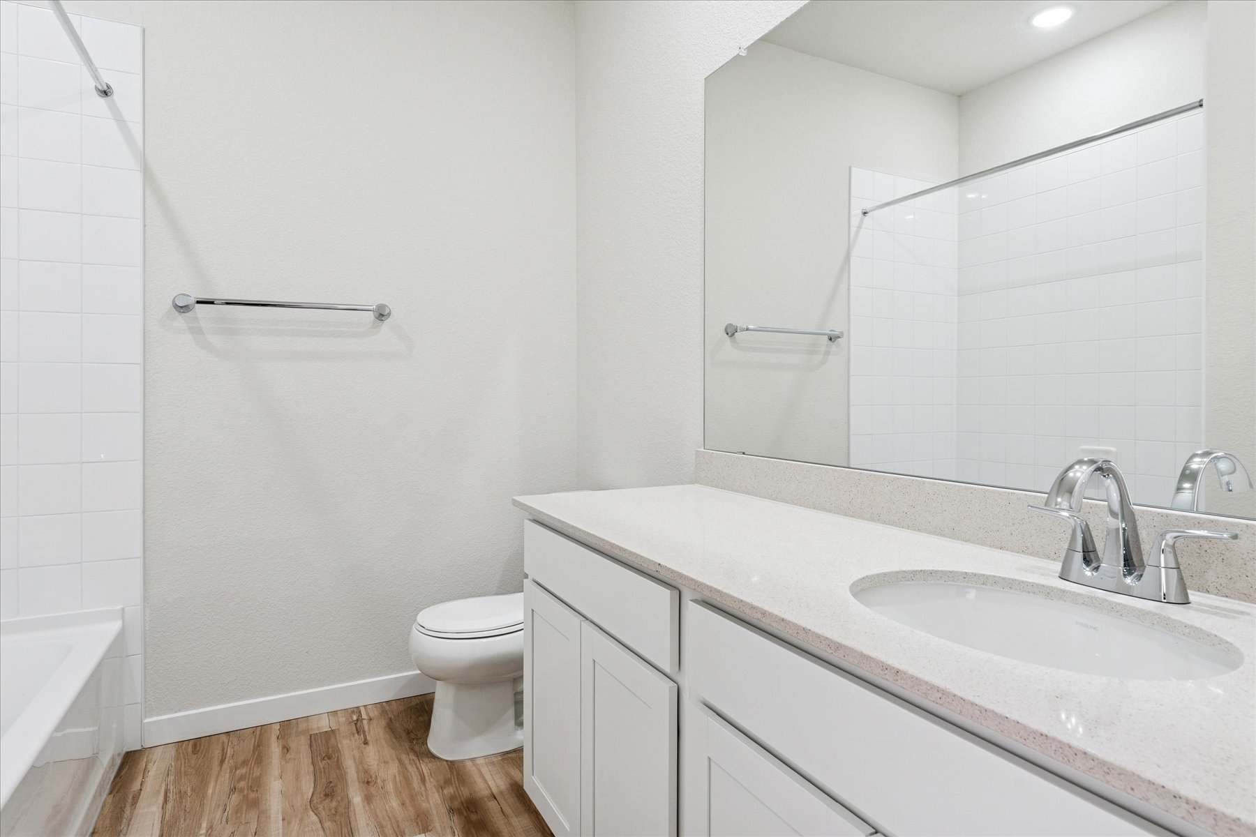 A bathroom with a sink and a toilet.