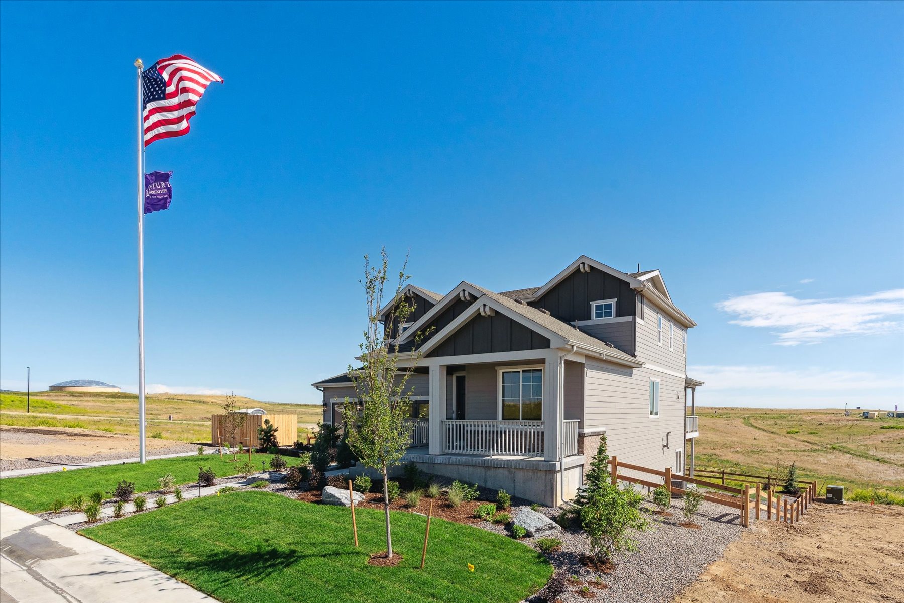 A house with flags in the front.