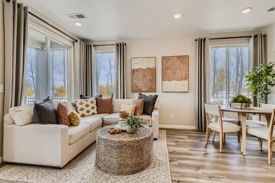 A living room with a couch and a table.