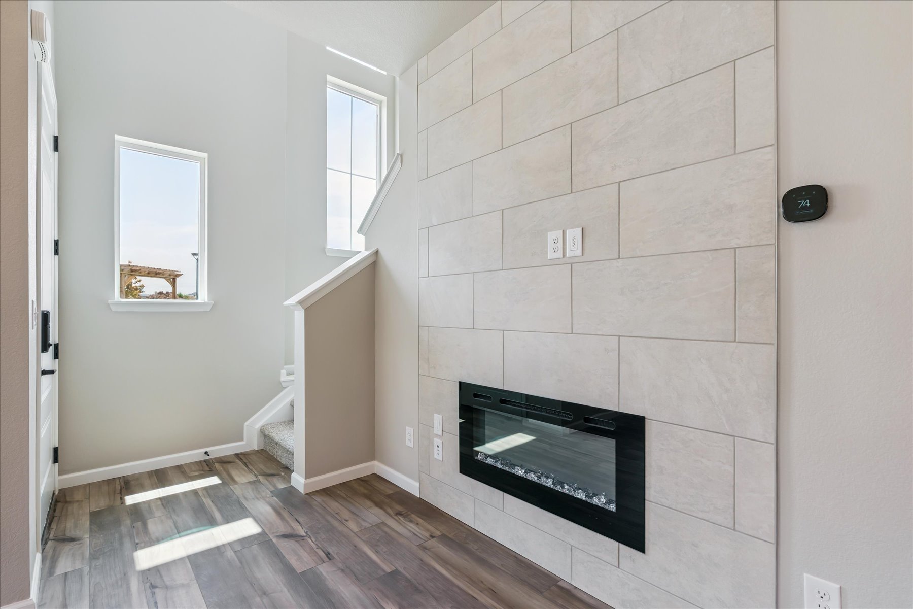 A room with a fireplace and a tv.