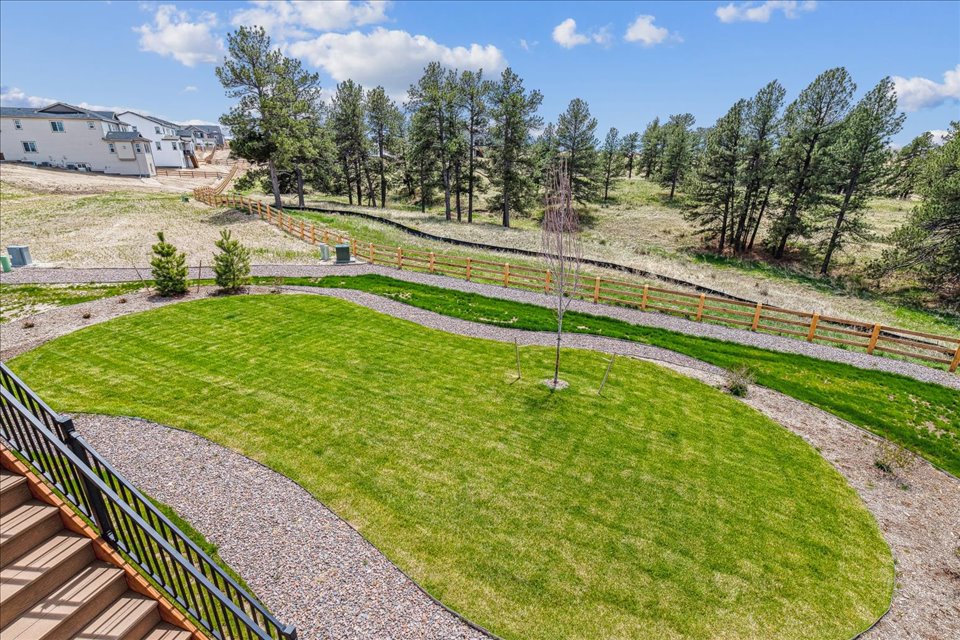A golf course with a fence.