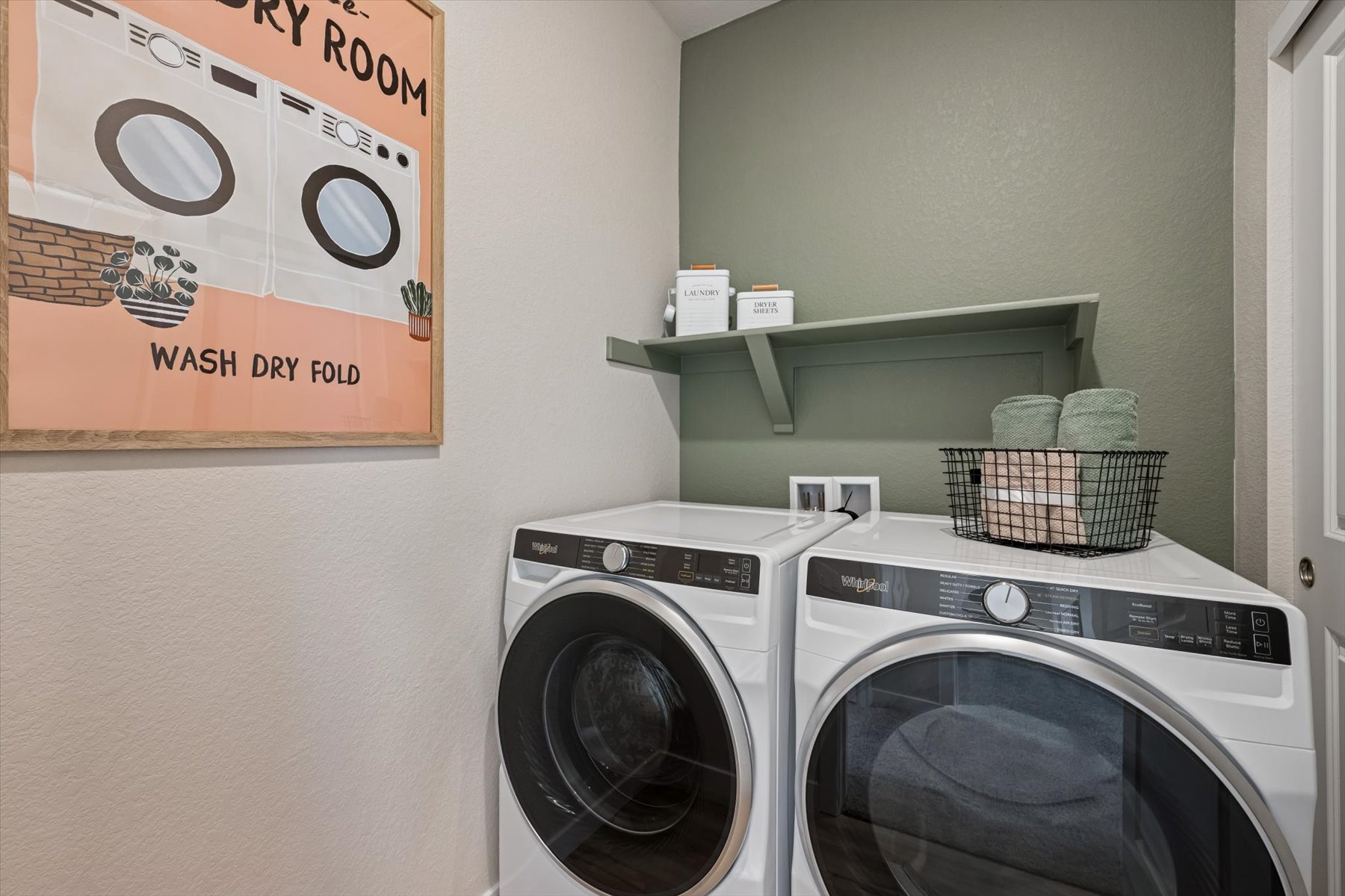 A laundry room with a washer and dryer.