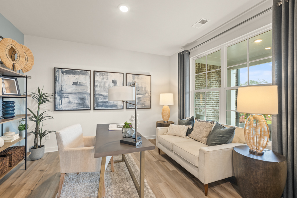 A living room with a couch and a table.