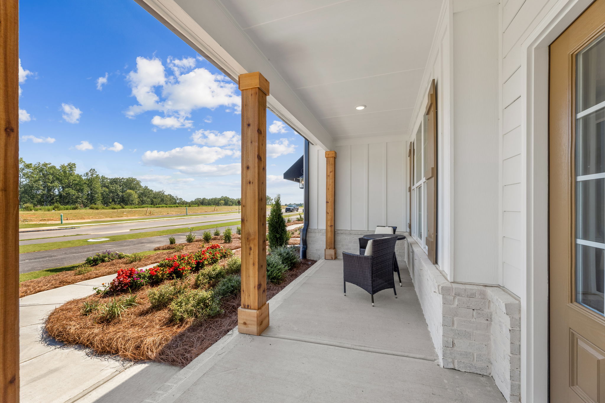 A house with a patio and a table and chairs.