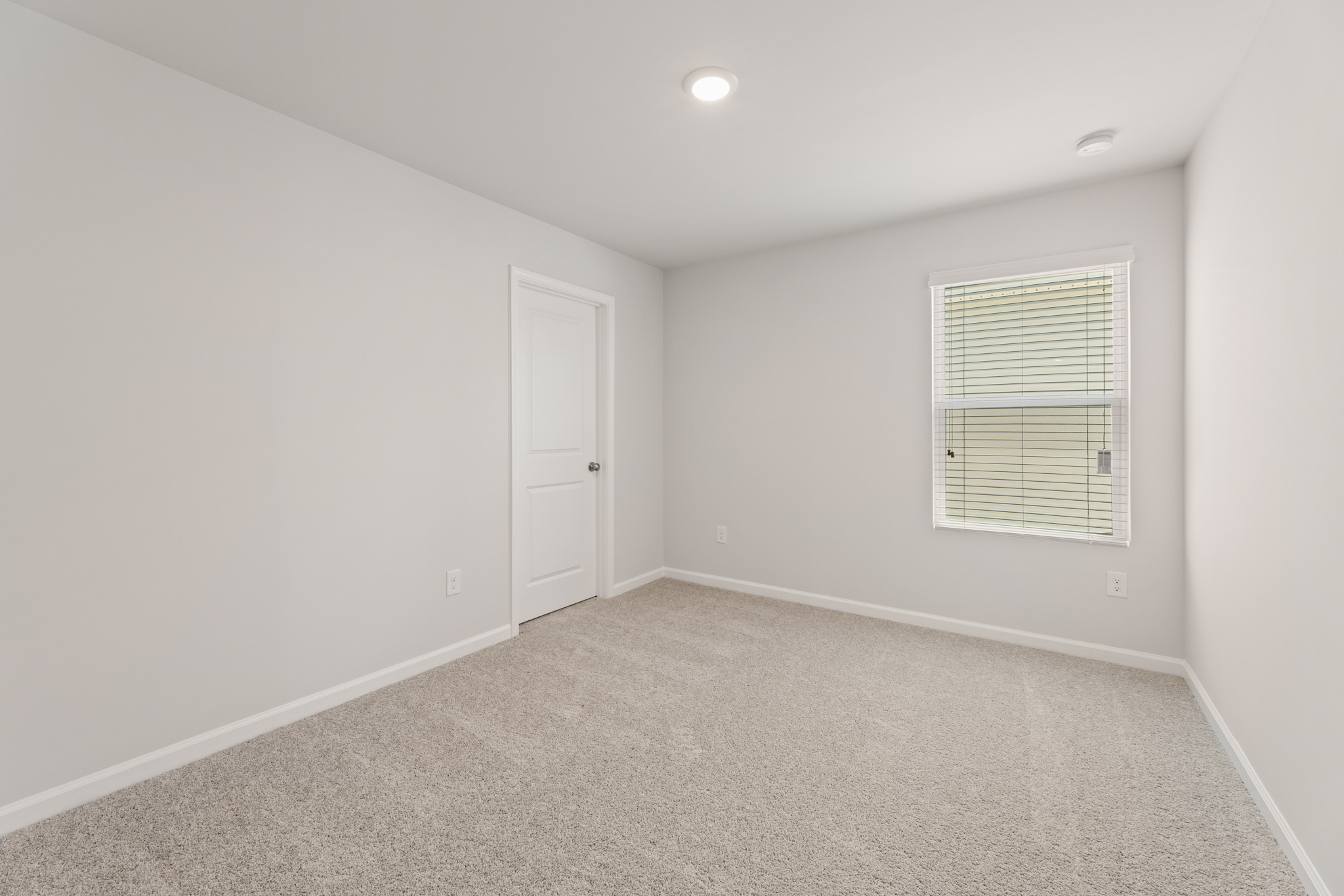 A room with a door and a window.