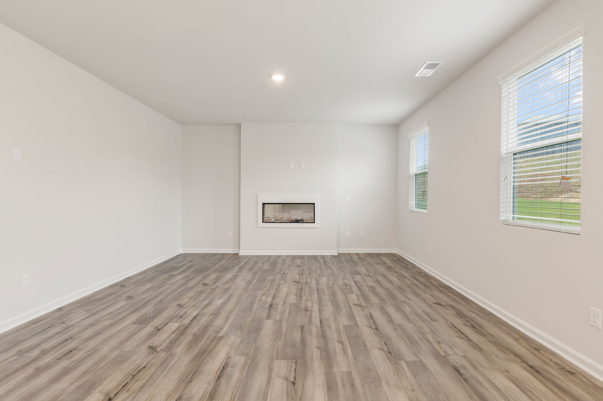 A room with a wood floor and a wood floor.