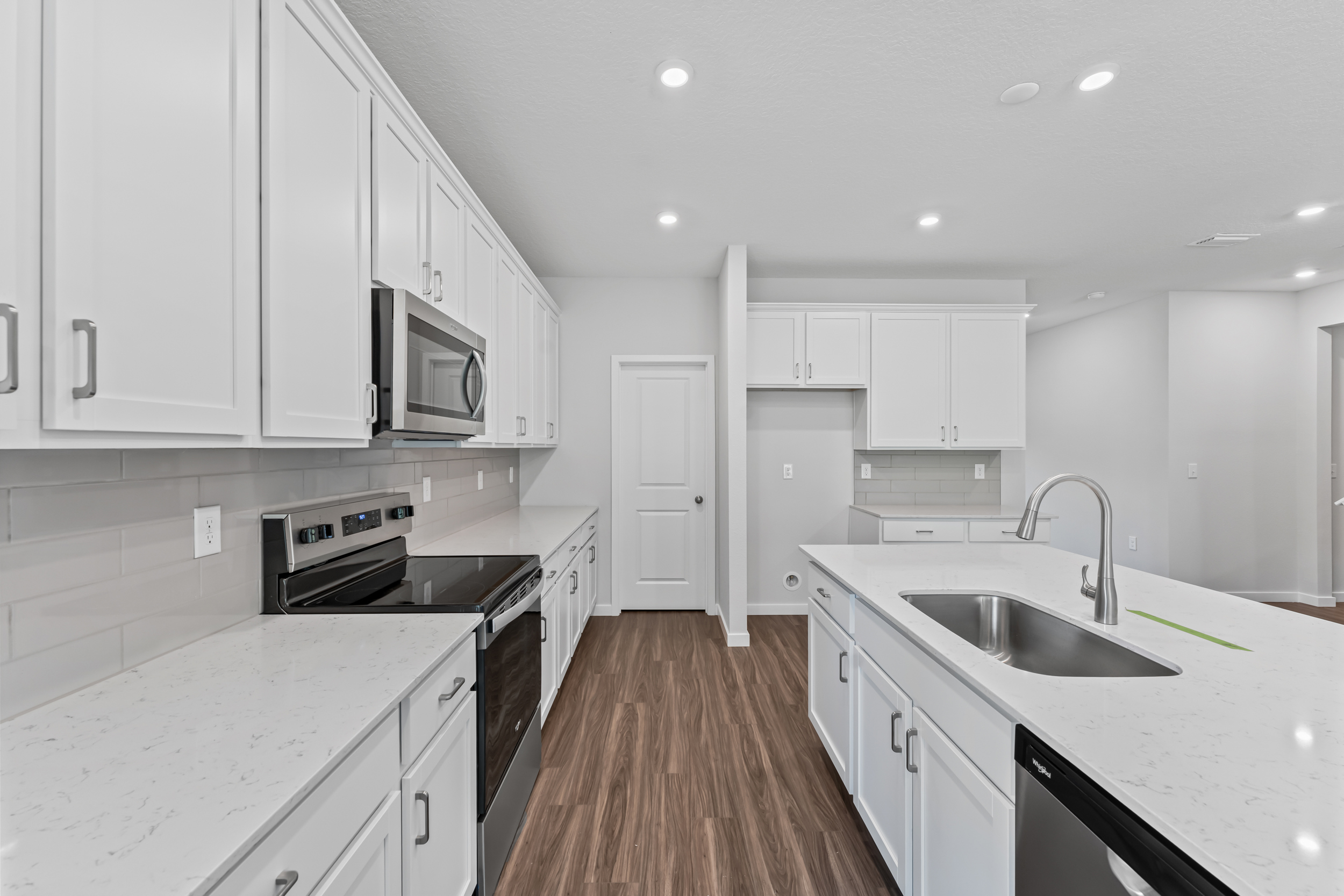 Dogwood Floor Plan Kitchen with White Cabinets at NorthShore in Kingsland