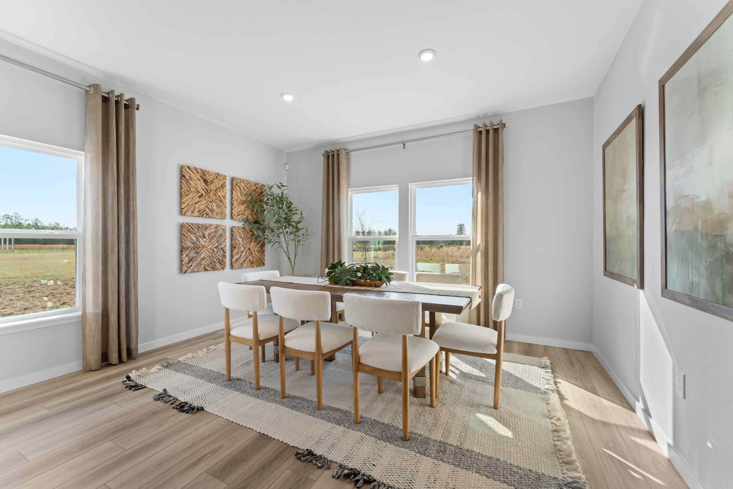 A dining room with a large window.