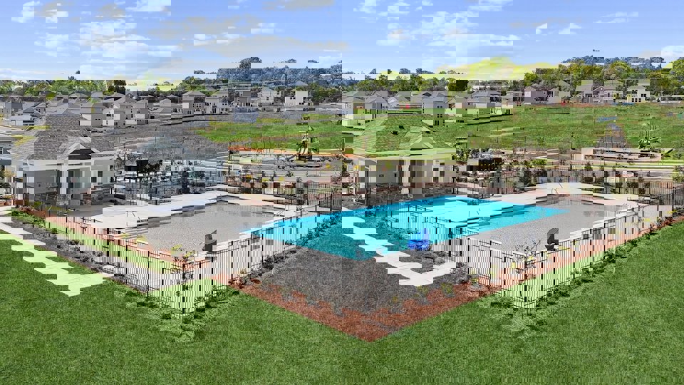 A swimming pool in a backyard.