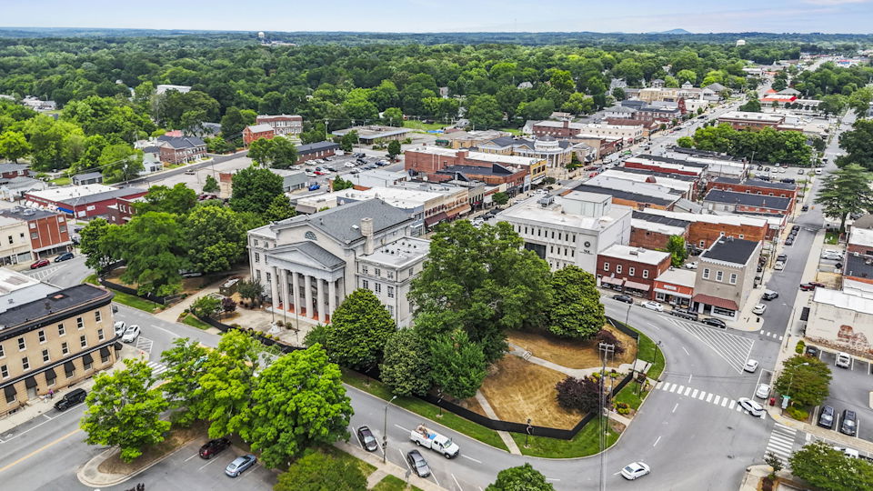 A city with many buildings and trees.