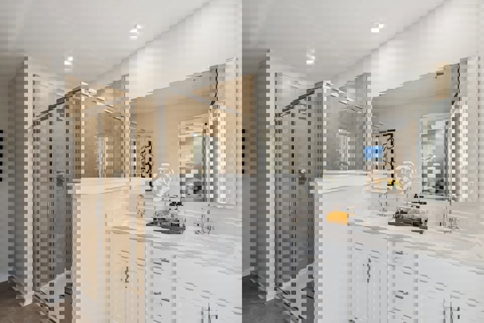 A bathroom with a glass shower.