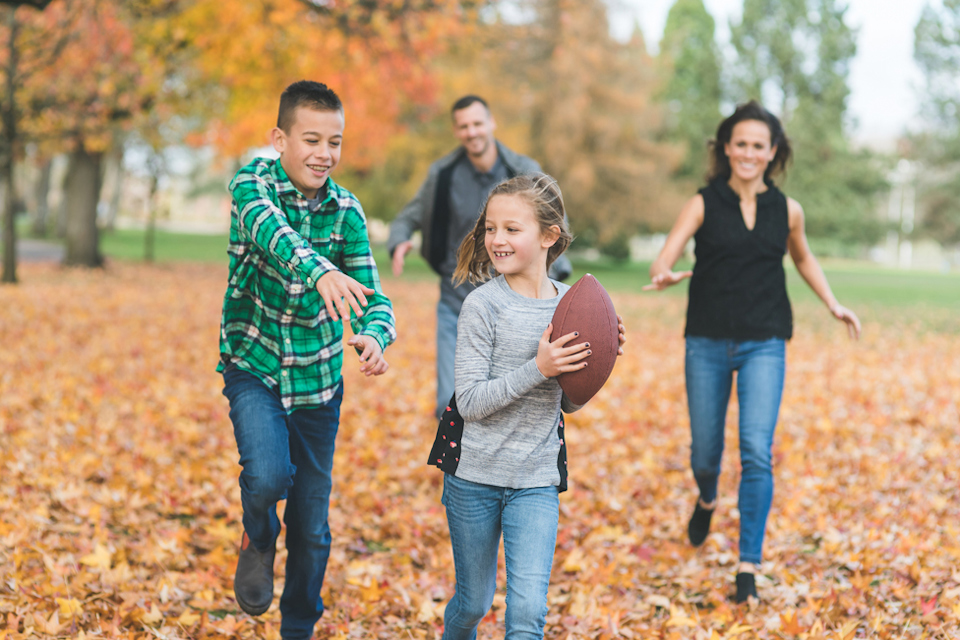A group of people walking in a park.