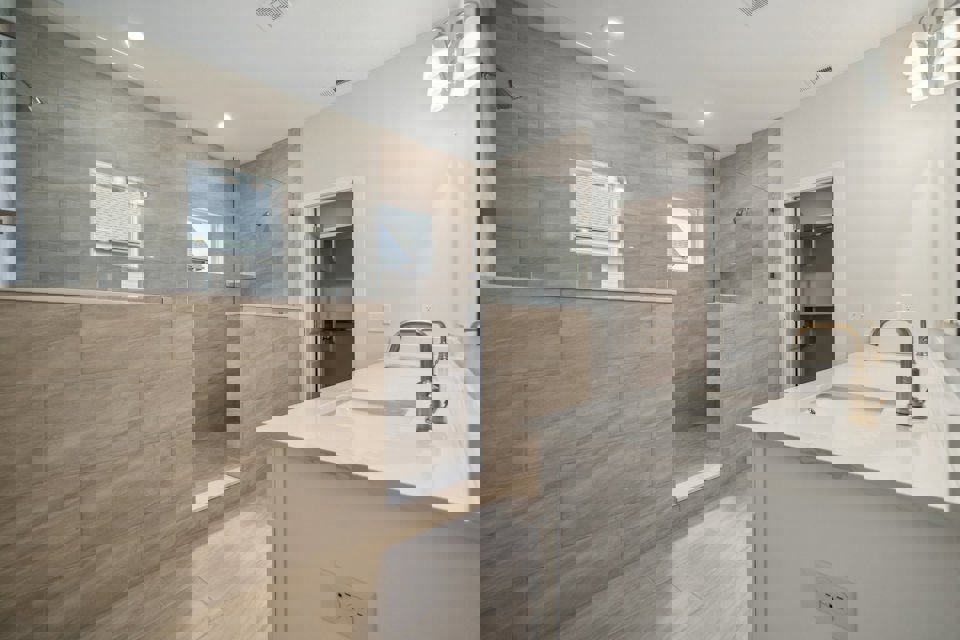 A bathroom with a large glass shower.