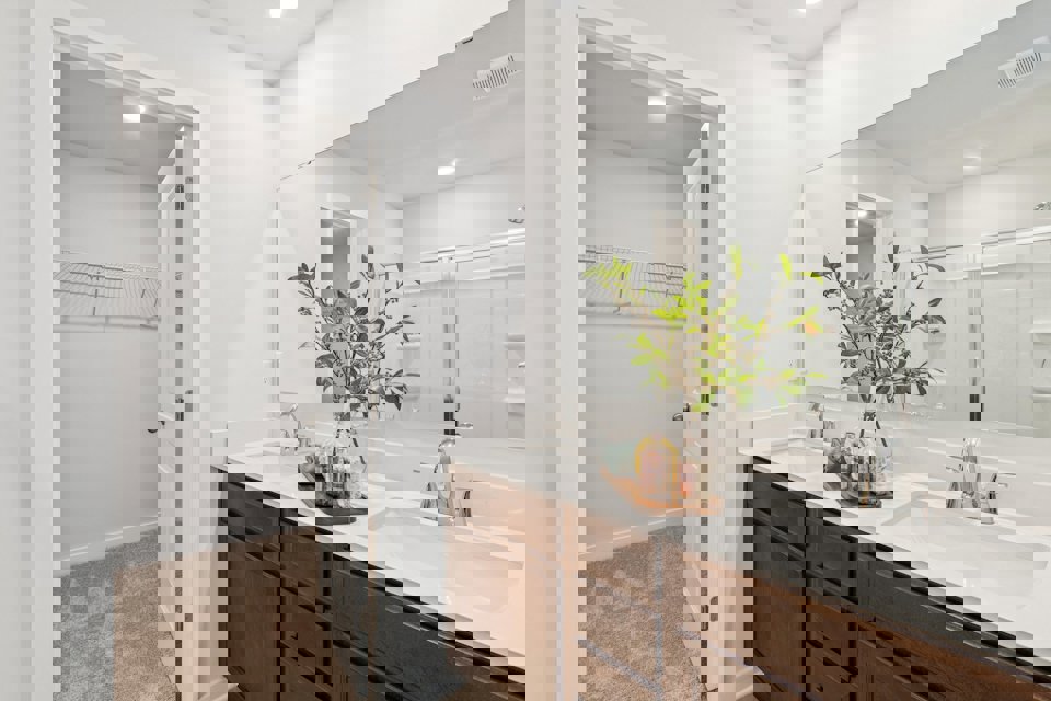 A bathroom with a large mirror.