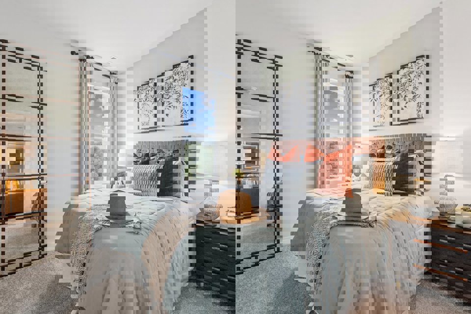 A bedroom with a large bed.