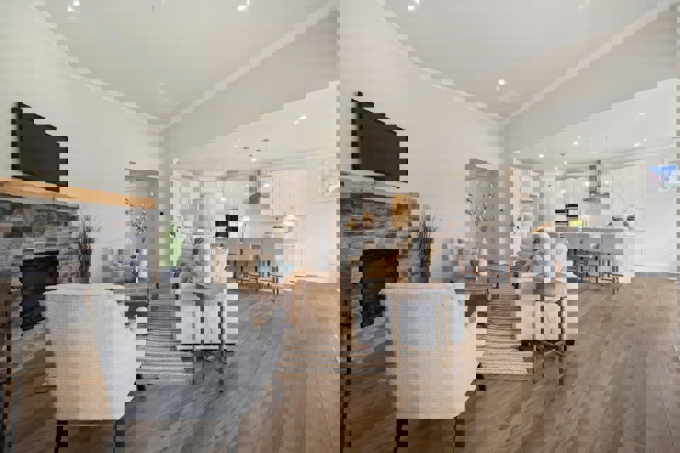 A large living room with a fireplace.