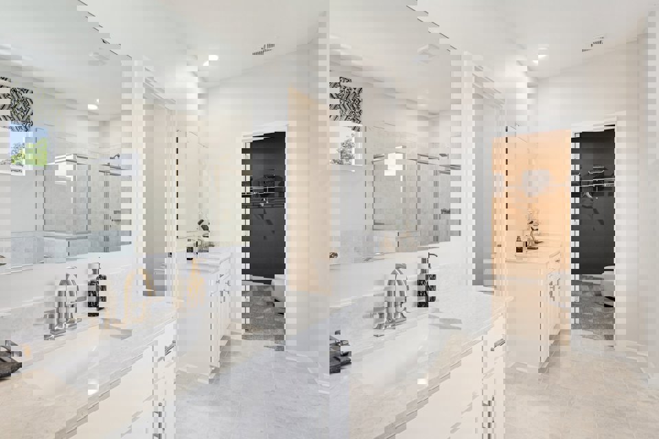 A bathroom with a large mirror.