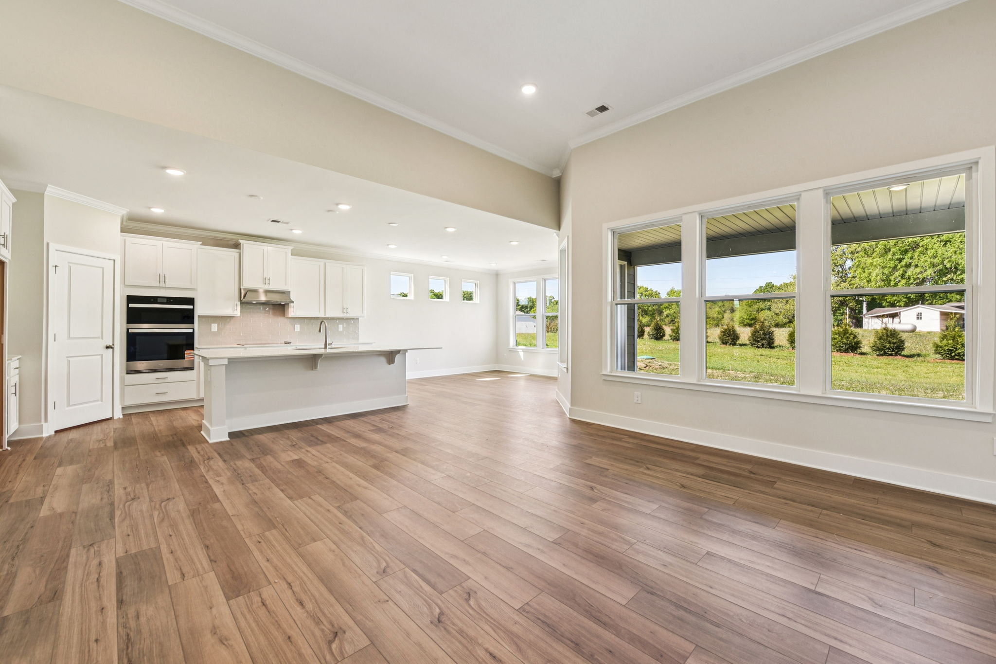 A large kitchen with white cabinets.
