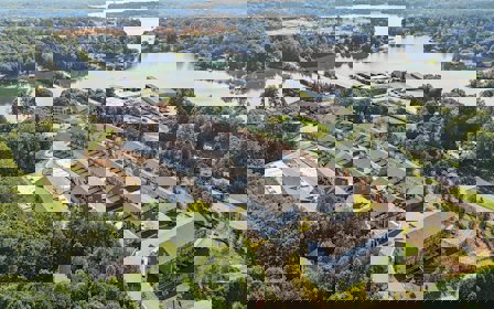 A large building with a river running through it.