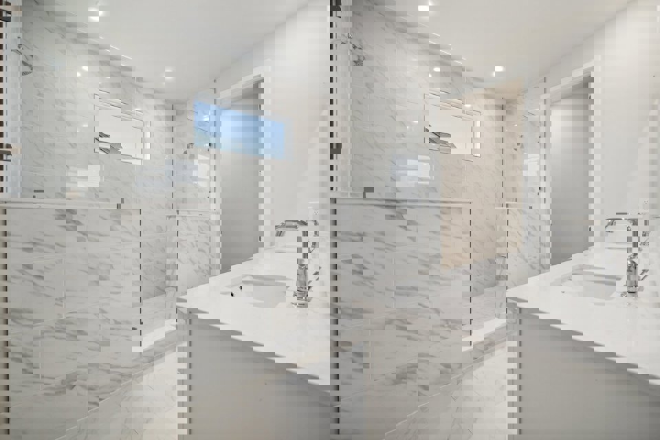 A bathroom with a glass shower.