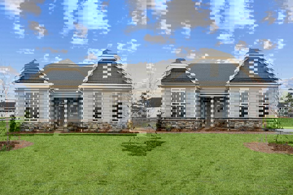 A house with a lawn in front.