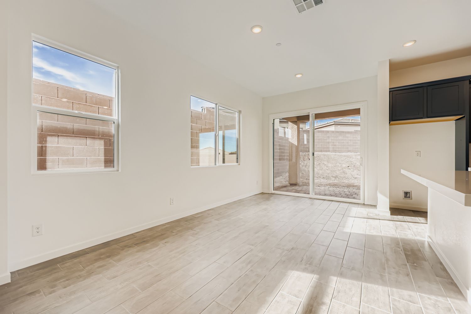 A room with a tile floor and windows.