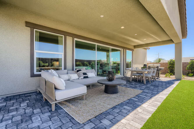 A living room with a stone patio.