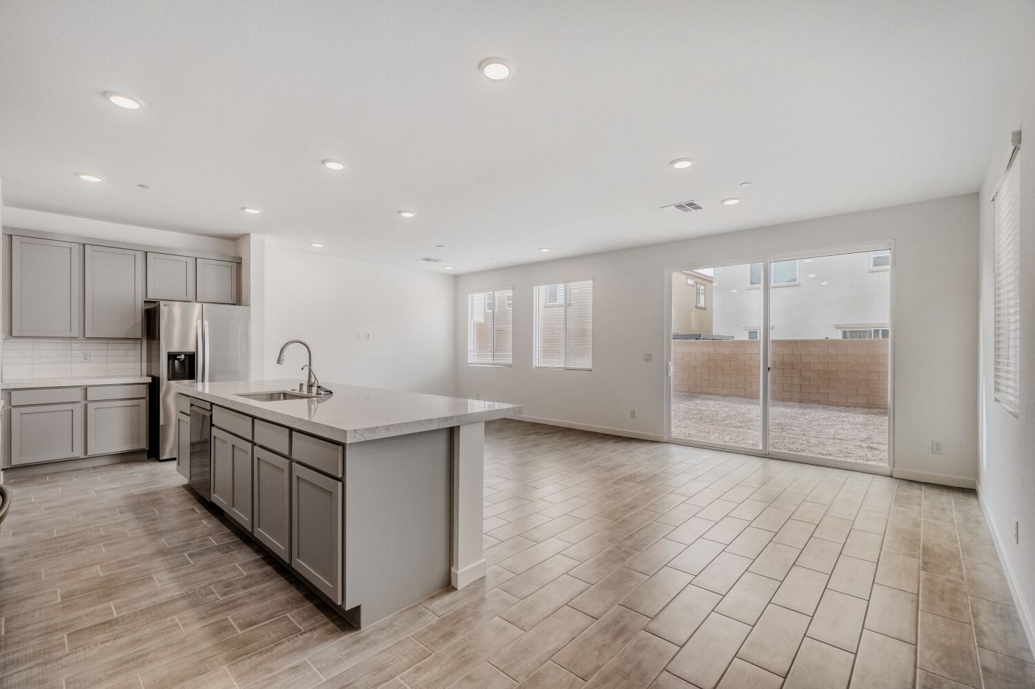 A kitchen with a glass door.