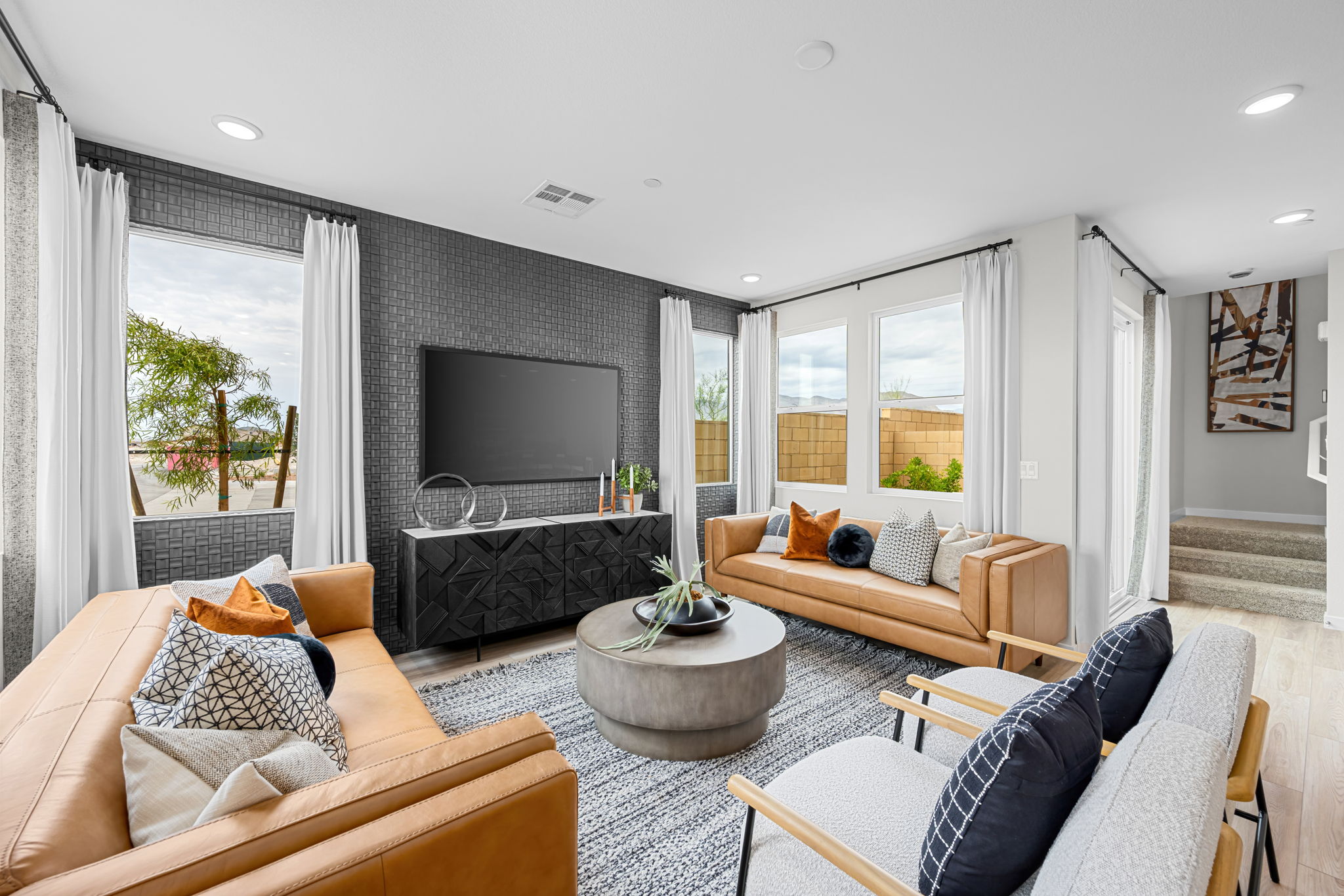 A living room with a tv and couches.