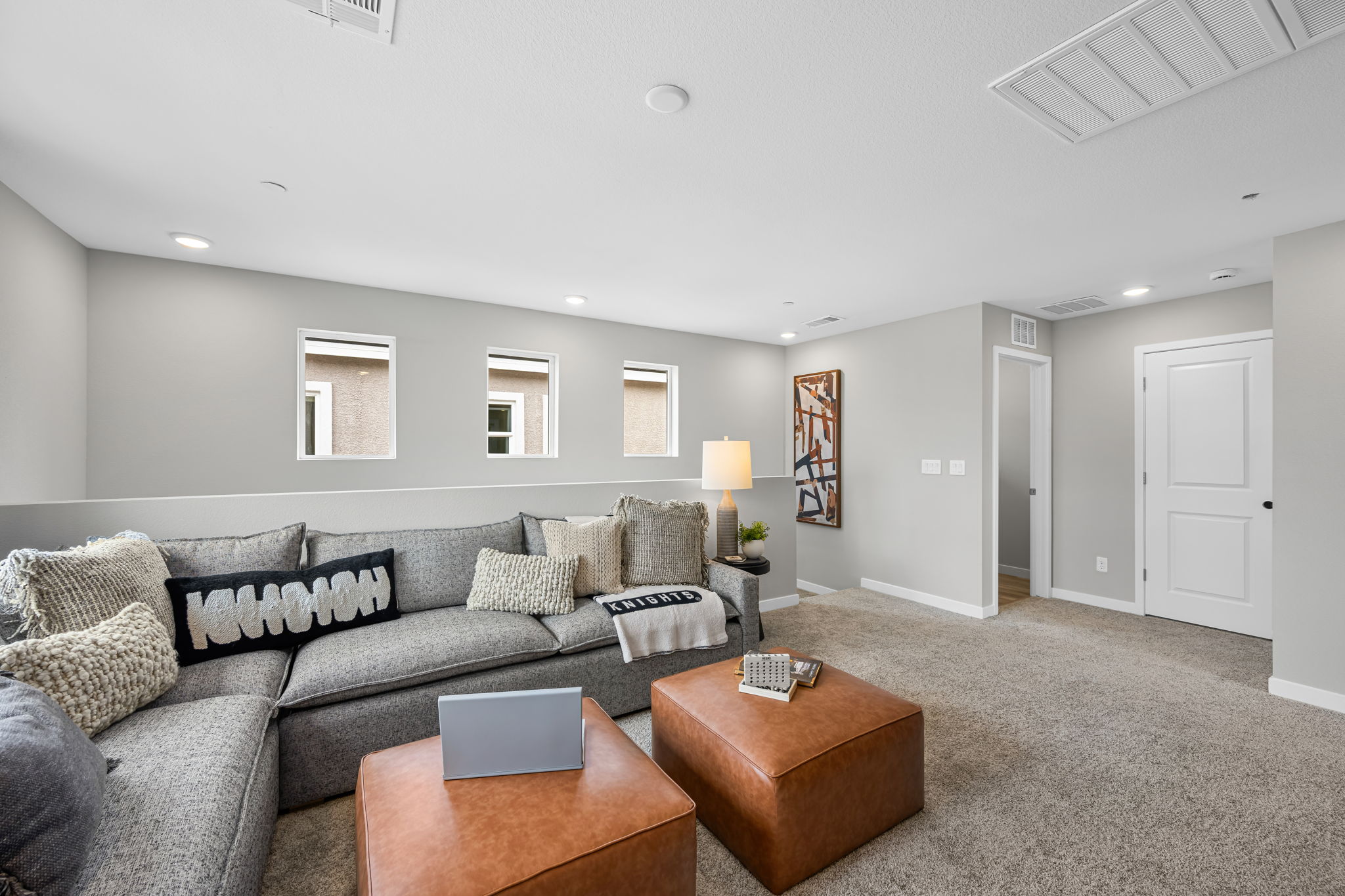 A living room with a couch and a coffee table.