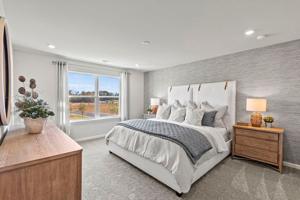 A bedroom with a large bed.