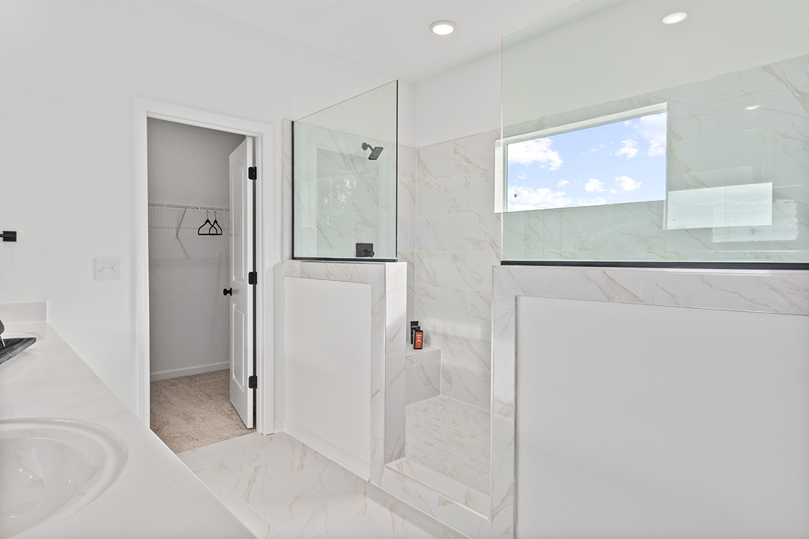 A bathroom with a glass shower.