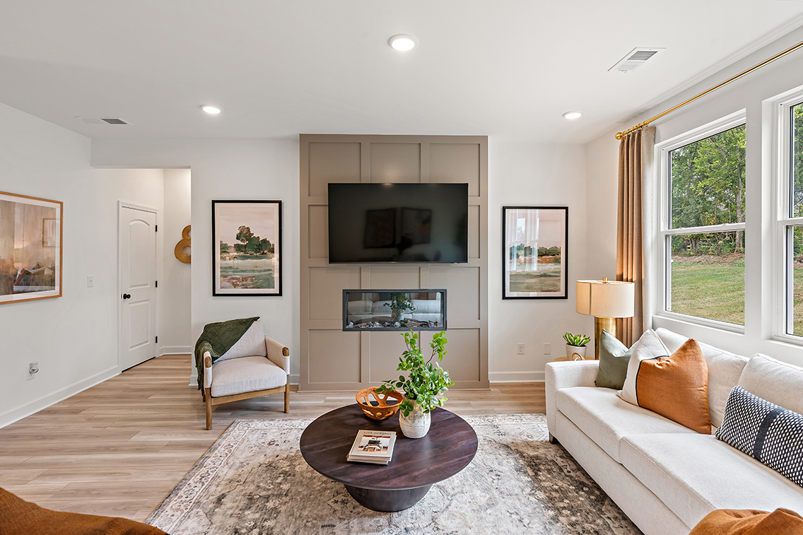 A living room with a large mirror.