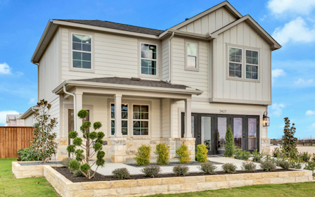 A house with a fence and trees.