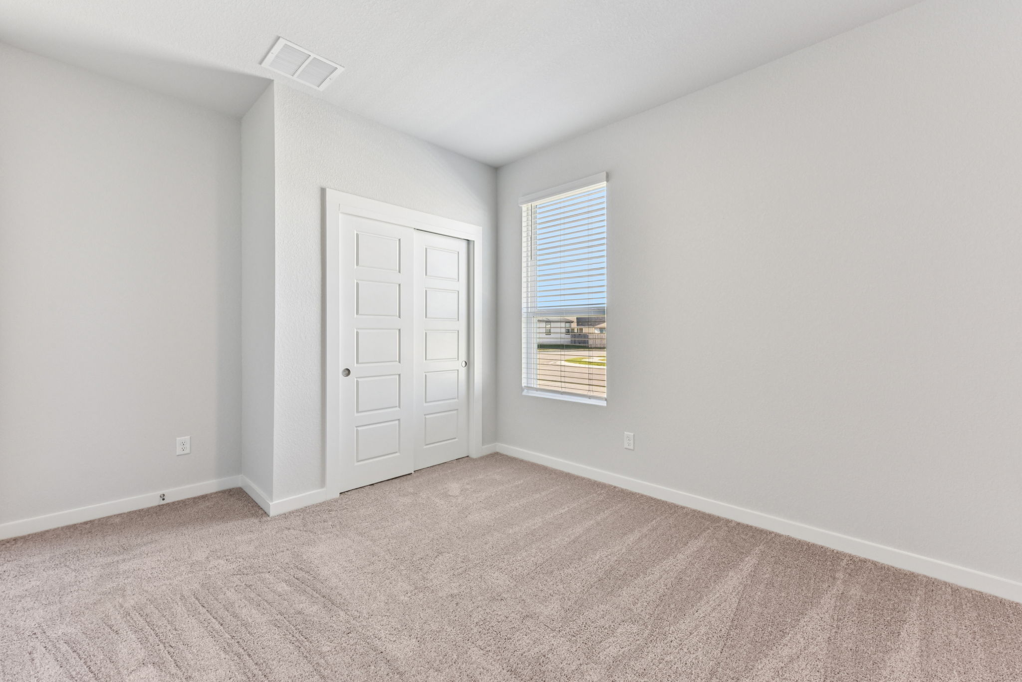 A room with a door and a window.