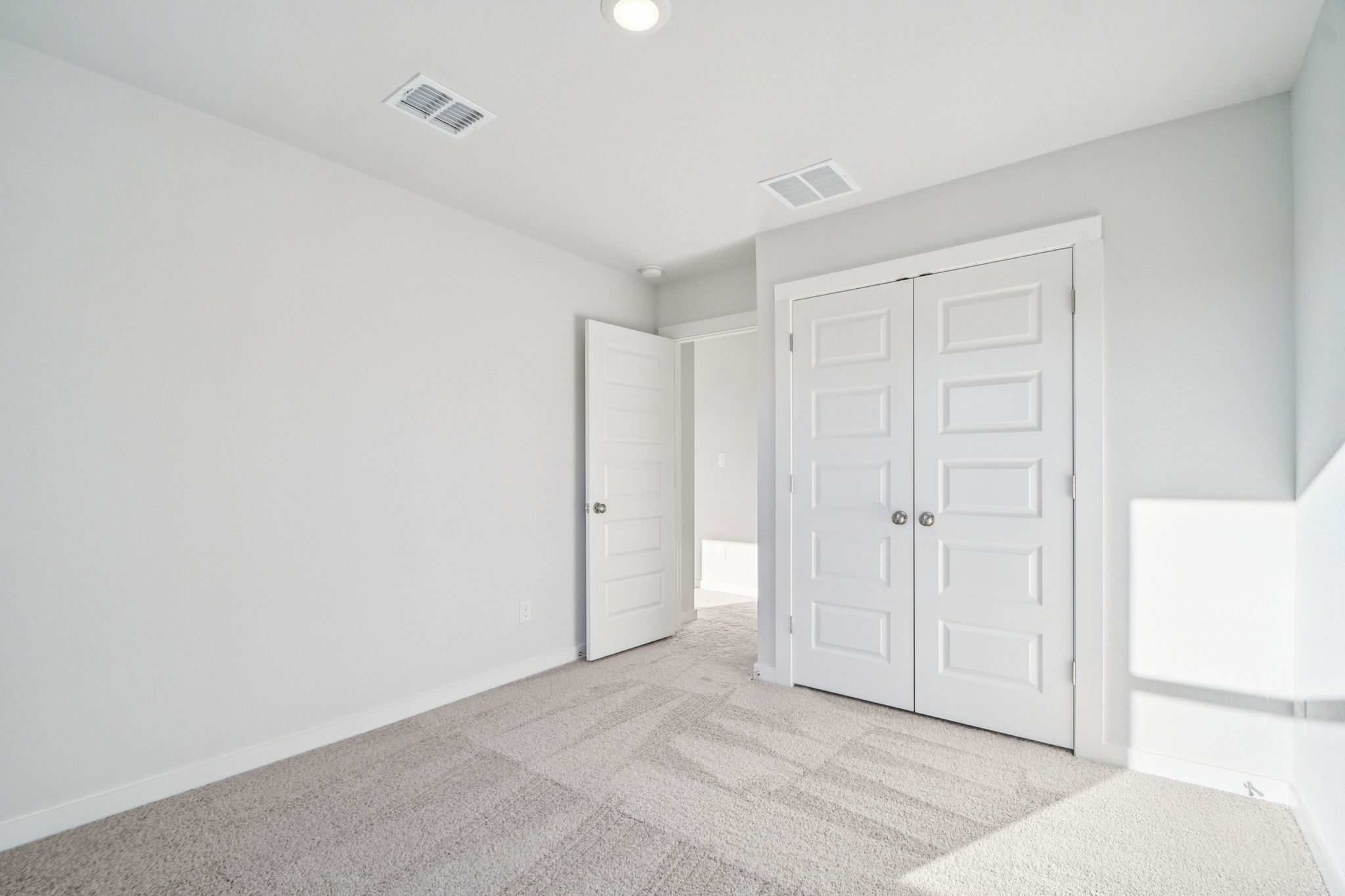 A room with white doors.