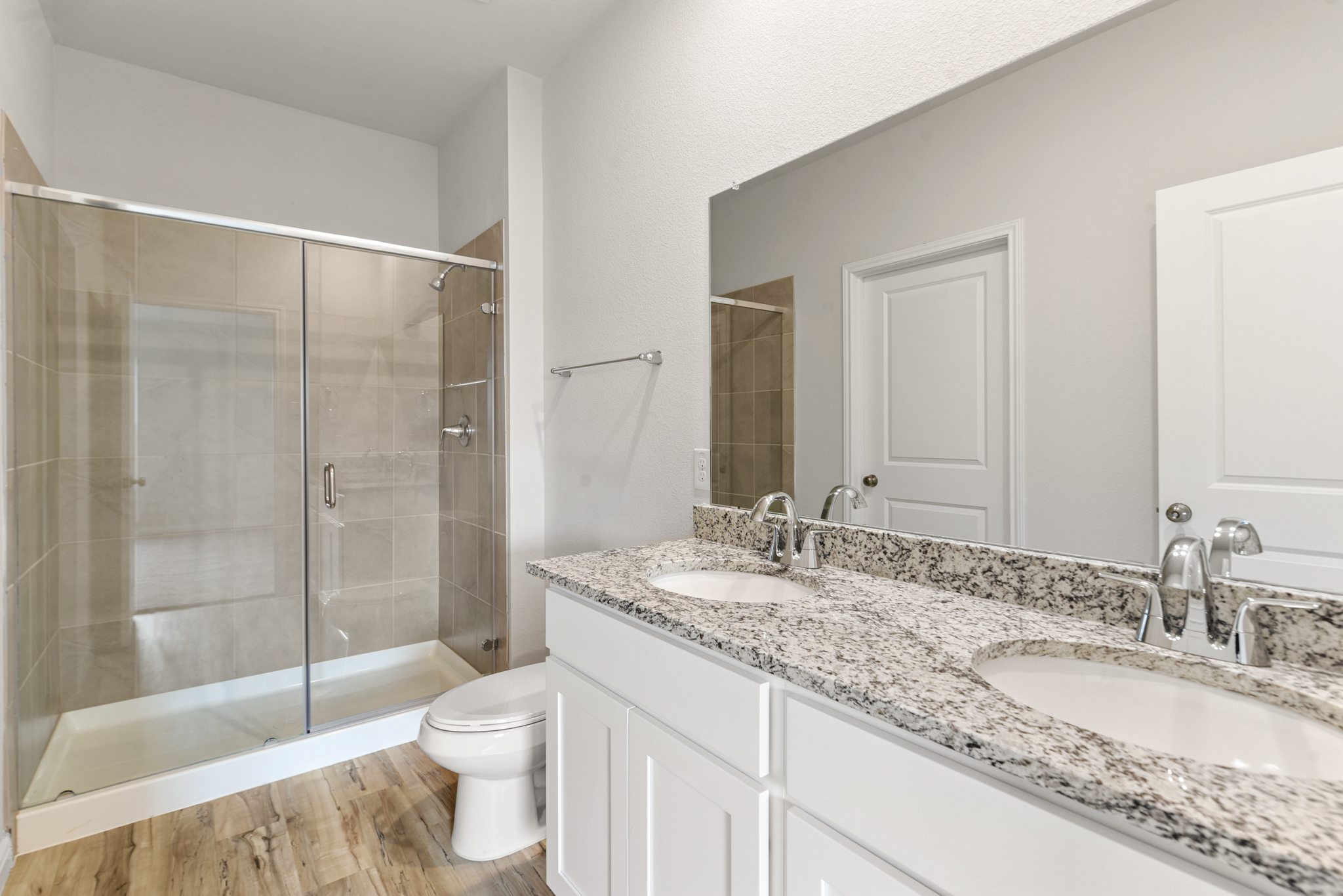 A bathroom with a glass shower.