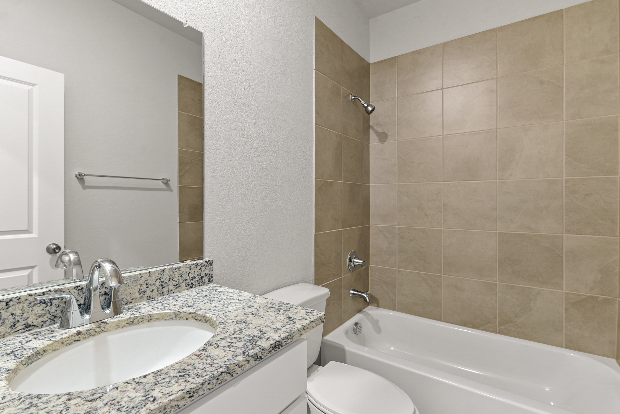 A bathroom with a sink and a bathtub.